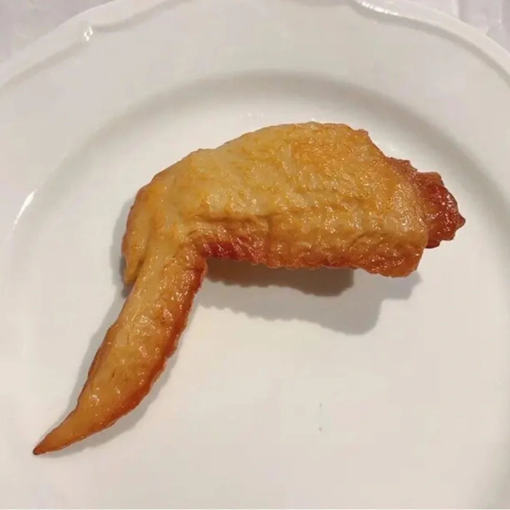 Wild and wacky fake chicken wing hair clip. Start the conversation.